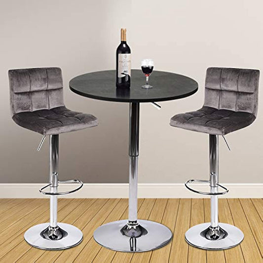 Black table with grey velvet fabric  bar stools  in the room